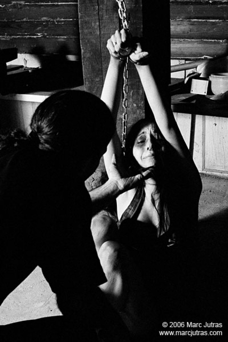 Amellya in a dark bondage scene