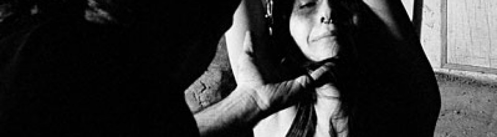 Amellya in a dark bondage scene